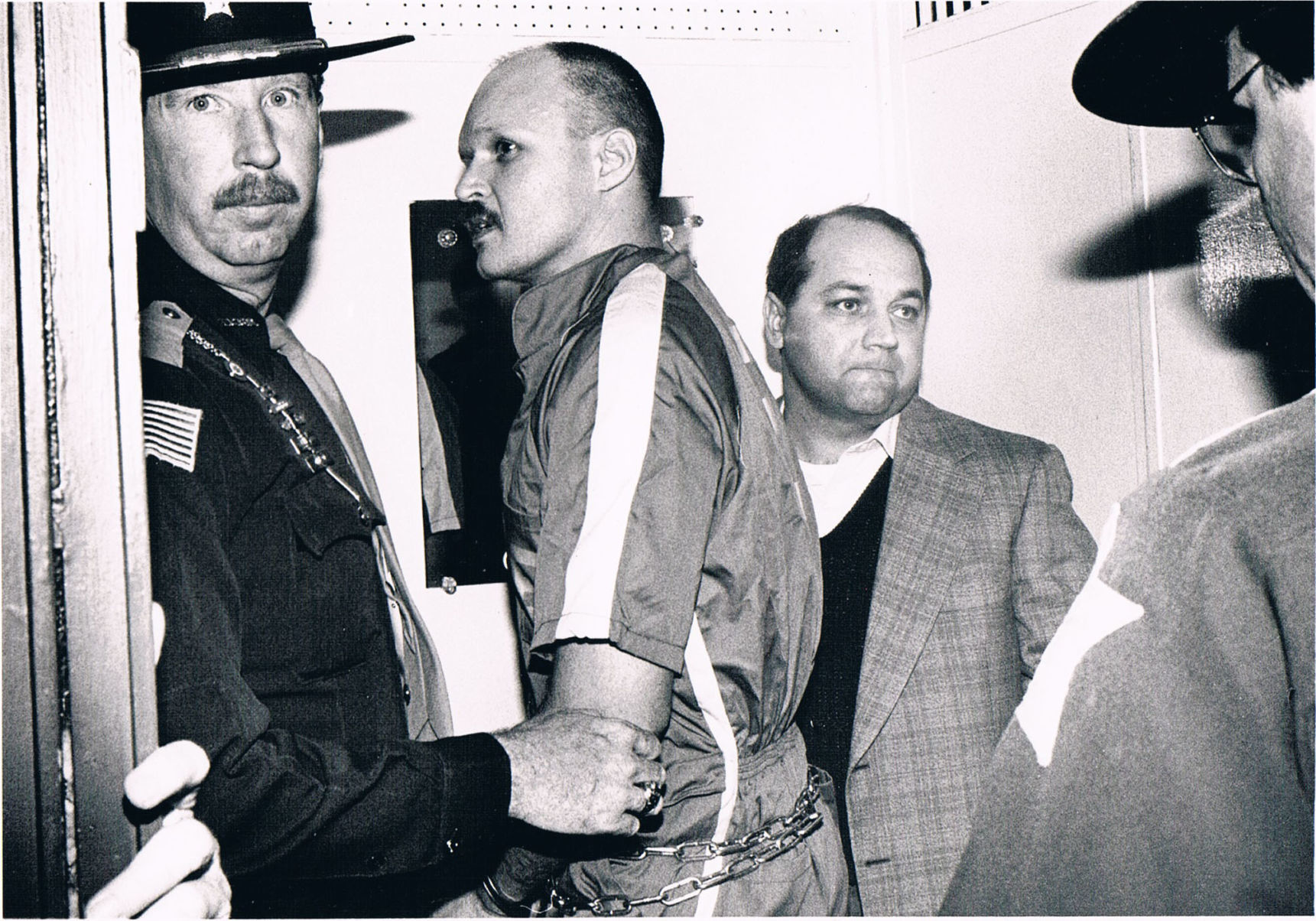 Larry Eyler handcuffed